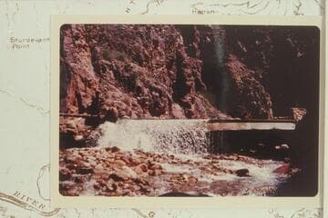 One of four aluminum trail bridges in Bright Angel Creek after being wrecked by the flood of 1966, Dec. 06.  In The Box
