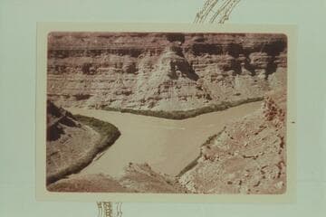 Three boats in the Friendship Cruise rounding the point at the mouth of the Green River