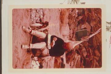 Dock Marston checks prints from previous parties in Cataract Canyon in order to determine locations