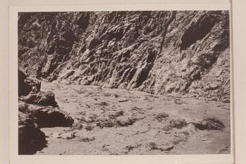 Emery Kolb in the boat "Marble" running the Sockdologer Rapid.  From LaRue Grand Canyon Vol. I in Huntington Library
