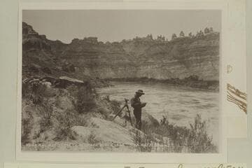 44.Station 8613 Down.  Brown-Stanton party.  The location is about one mile above Red Lake Canyon.  The Sentinels are upper right and Spanish Bottom is at right.  Stanton changed to No. 37.  The instrument is a level.  Mile 214.2