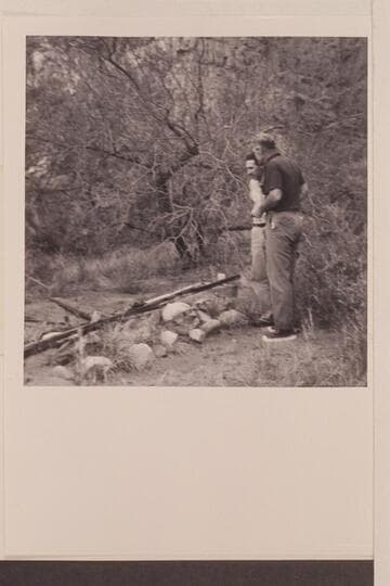 Don Harris and Rod Sanderson at grave of David Quigley.  Marble Canyon.  President Harding Rapid.  Mile 43.5.  David Edward Quigley.  Drowned 1951, June