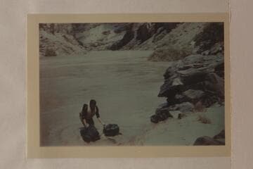 Bill Beer pulling his bags into the river in preparation for the swimming of Hance Rapid