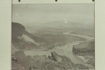 Looking upstream into Boulder Canyon Reservoir Site from Point of Rock on Nevada side near upper end of canyon.  Boulder Wash in foreground.  Sacramento Wash at right in distance and probable camp site on beach at extreme right