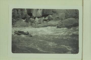 Bill Davis in Triplett Rapid.  Photo from left bank