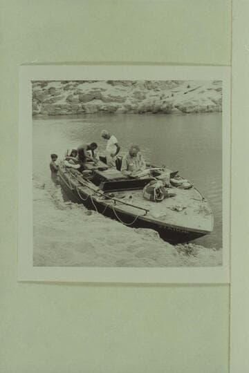 The camera boat at Separation Canyon.  Roy Klinger works aft as Gordon Avil watches.  Jim Algar studies the script