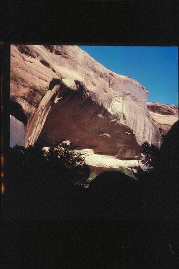 Large cave in upper Surprise Valley. A few small ruins in this cave. Names of M.A. Smith, O.B. Lundahl 7-16-08