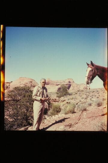 John Doerr near trail to Rainbow Bridge; Cha Butte in background