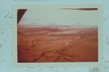 Northerly across the lower end of Halls Creek and Bullfrog Creek to the Henry Mountains