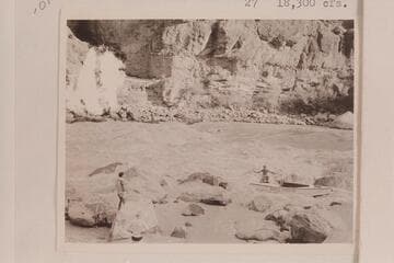 Lining the Nevills skiffs at Lava Falls.  Nevills is in the boat.  Garth Marston is handling the stern line and Randall Henderson watches