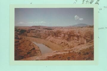 Lake Powell about to submerge "Poor Man's Placer".  From the top of the cliff at Mile 109 3/4.  Navajo Mountain at right