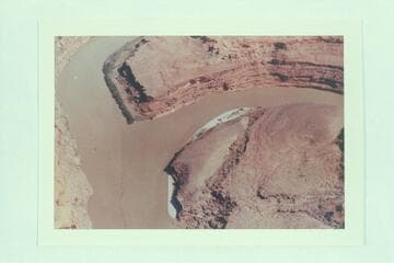 The Colorado River run[s] down the left side of the print.  The San Juan enters from the right