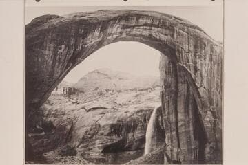 Rainbow Bridge with the fall of a flash flood in back of it