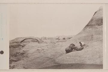 USGS Glen Canyon party.  Looking across San Juan Canyon from near Mile 78.  Arch in mouth of San Juan