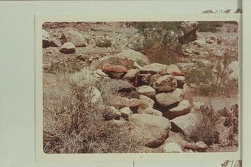 Circular structure about two miles up from mouth of Chuar-Lava on right bank above stream, showing a wine bottle
