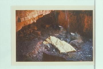 Wet sleeping bag and cooking equipment left near the Hance Mine