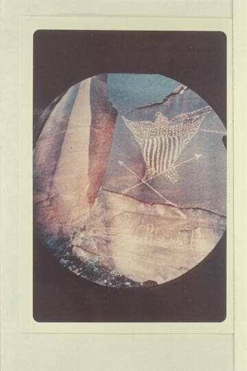 Inscription at right bank about 2 miles below Hole in the Rock and on the right side of the road grade