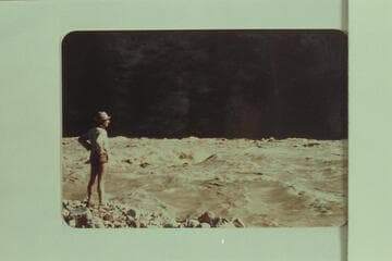 Marston sizing up the situation in Hance Rapid before running the "Esmeralda" through it