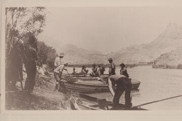 USGS preparing to leave Lees Ferry in 1923.  The boatman with the chest at waistline is Lewis R. Freeman