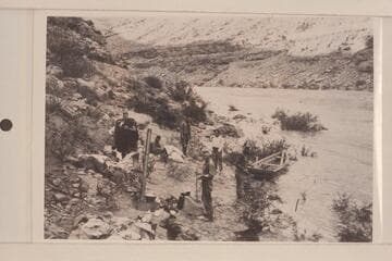 Camp below Mendenhall Loop where flood drove us out.  Loper with bedding.  Left to right:  Loper; Hyde; Trimble; Christensen; Blake; Miser