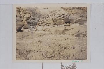 Skiff of the Dusty Dozen dropping into the hole near right bank of 85 Mile Rapid