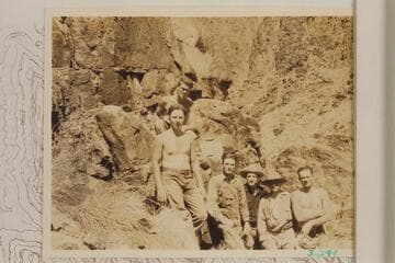 The 1934 crew members with the marker they fastened there