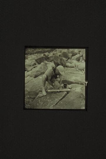 Placing the sign at Brown's Riffle; Mile 12 in Marble Canyon