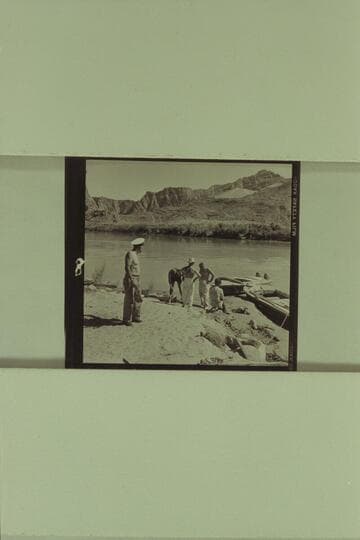 The boats being rigged for the motor traverse of the Canyon.  Left to right:  Sanderson; Belknap; Marston; Masland' Jordan.  The boats are the "Bootoo" and the "Cactus."