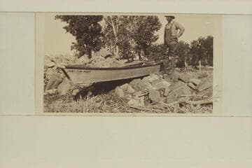 Portage of Freeman's steel boat around the intake dam at Glendive