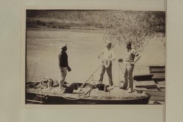 The crew of the motorboat "Hudson" before the start from Lees Ferry.  Dock Marston; Joe Desloge; Guy Forcier.  The "Esmeralda" is at the right