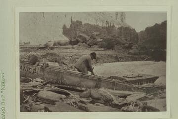 Pulling boats out of river at Badger Creek, the "Titanic" and "Ross Wheeler".  Note the ice