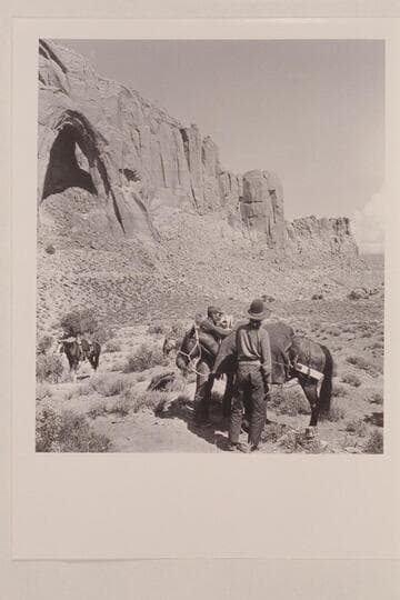 Arch in the Sky; Bahe and White-hat load the packs