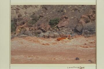 Rowlanfd Deck Boat swings to the left and clear at Vulcan Rapid.  Jim-Bob Rowland was at the wheel and killed one engine.  Wes Hildreth was aboard and is seen waving to his wife on shore
