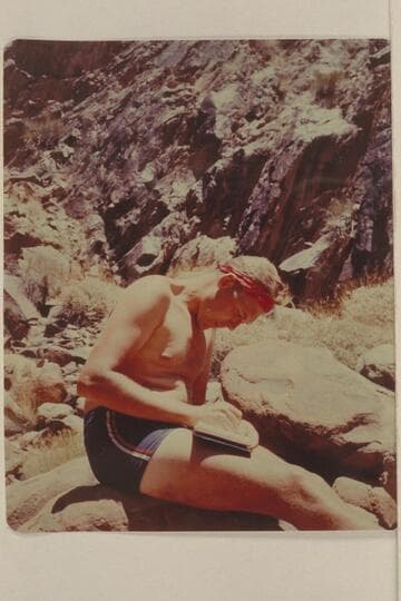 Bob Malott writes the record.  Camp at Mile 107