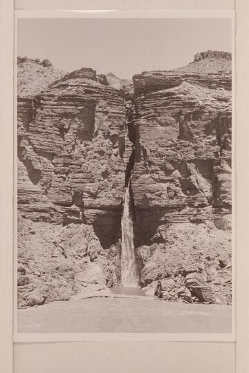Deer Creek Falls.  The clear water of the lagoon is held by a low sand bar