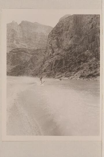Cooper skiing on upper Lake Mead in Grand Canyon.  The "June Bug" is in the distance