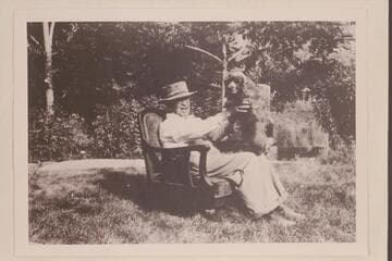 Doc Inglesby and Judy in chair used by Julius F. Stone during traverse of Glen Canyon in 1908