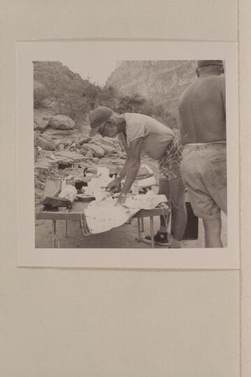 Ballard Atherton at the commissary chores.  Camp at Mile 210