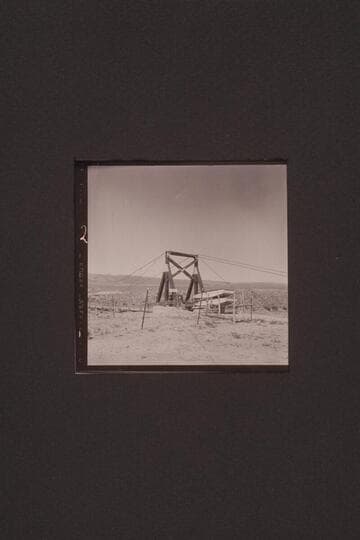 AK Reynolds truck and boats crossing new suspension bridge in Brown's Hole