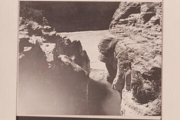 Looking out of the mouth of Supai Creek where the clear water mixes with the mud of the river.  Ballard Atherton climbs at left
