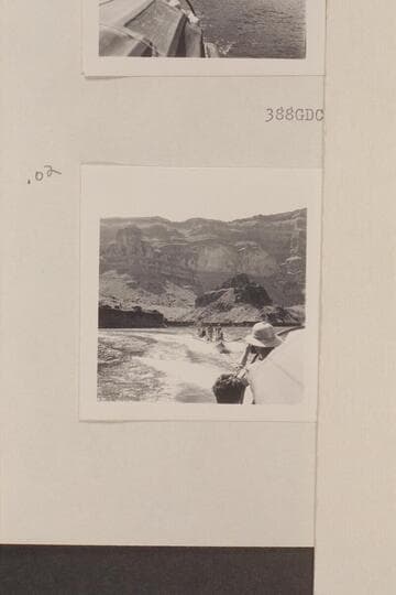 Nevills boats under tow and the crews standing in them for photos.  Approximately the Grand Wash Cliffs on Lake Mead