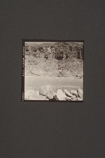 Rod Sanderson puts the "Twin" through Mile 217.  Jack Couffer photographs the run