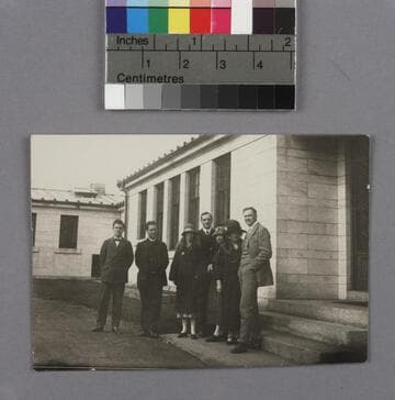 Edwin Powell Hubble, his wife Grace Burke Hubble, and five (5) companions standing on the steps of a building in Wellesley, Mass