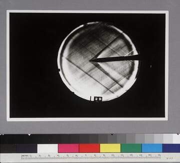 Shadow photograph of wind tunnel test results, showing the air stream from a 30-degree cone head model