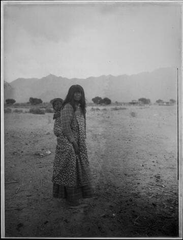 Mother with child on back