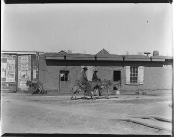 Santa Fe street scene, men on donkeys