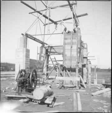 Tower 101 rebuilt with huge concrete base near marsh