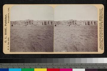 Distant view of Acoma Pueblo, New Mexico, on top of mesa.  Mission Church can be seen in center