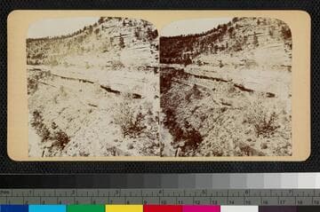 Ruins of cliff dwellings in the crevice of a canyon wall