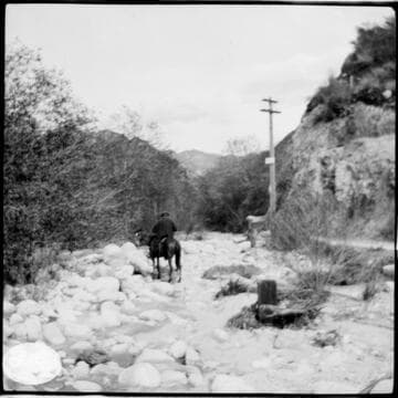 People riding horses in Santa Ana River Canyon along the transmission line